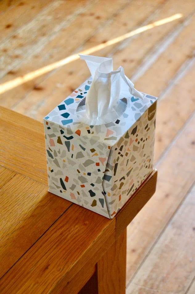 A box of tissues sitting on a countertop.