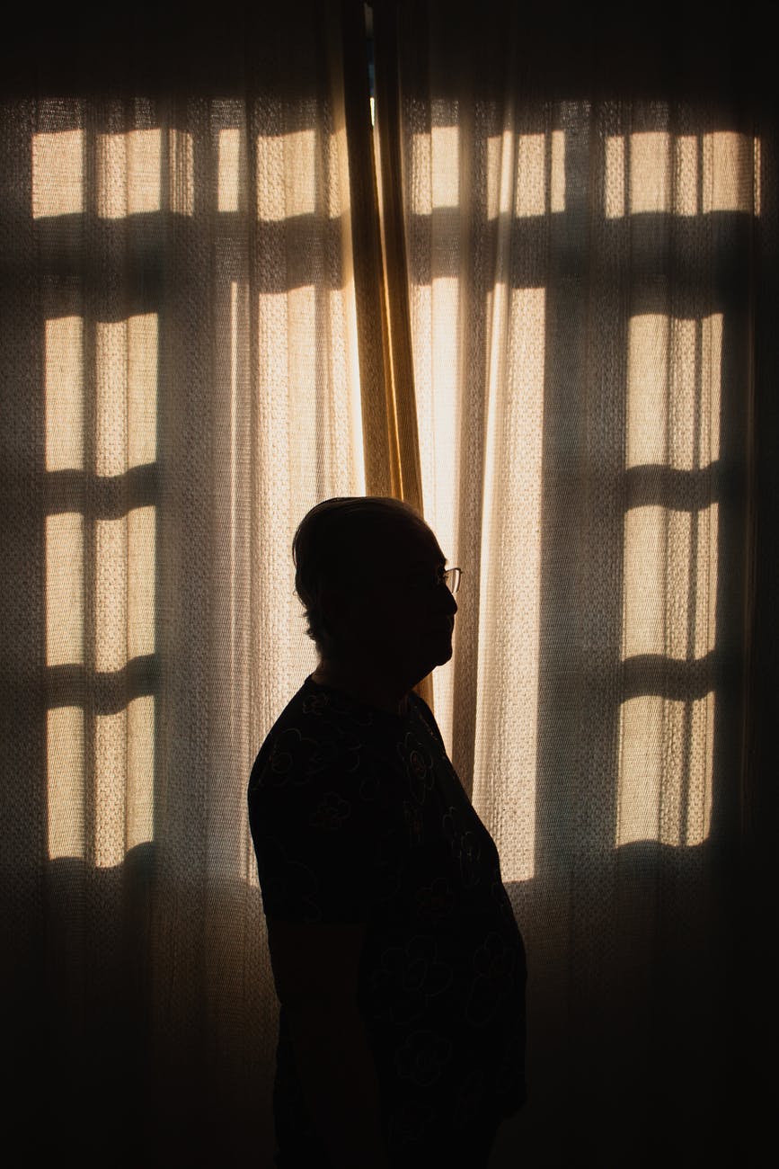 Silhouette of a man indoors.