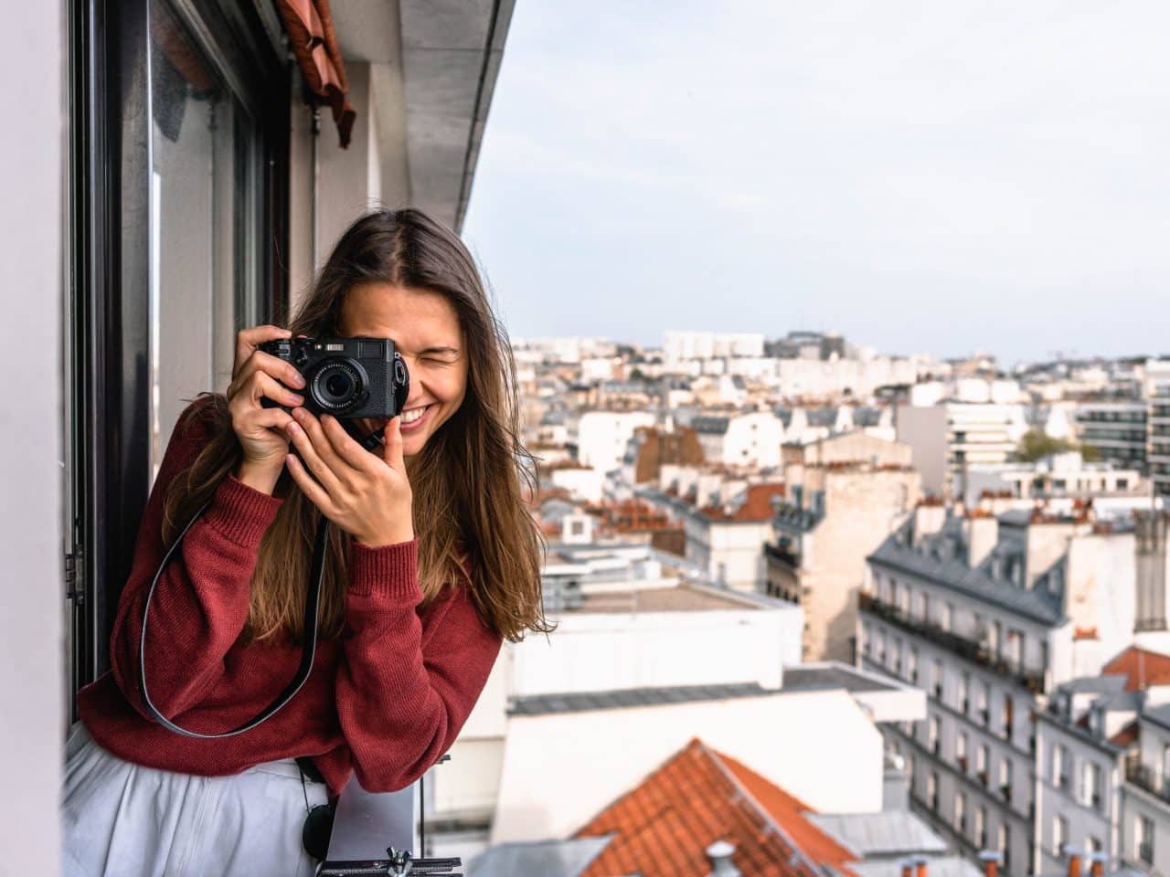 Female tourist taking a picture in a new city.