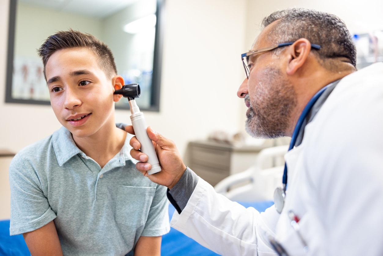 Young boy getting his hearing tested.