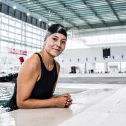 Woman with a swimming cap on in the pool