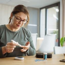 Woman checking her blood sugar