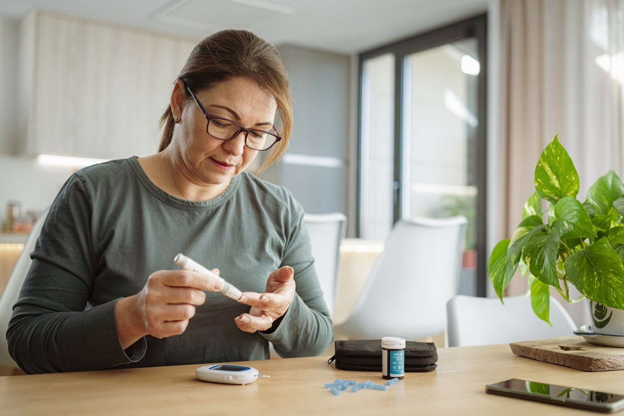 Woman checking her blood sugar