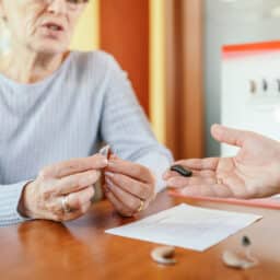 Senior woman looking at her hearing aid options