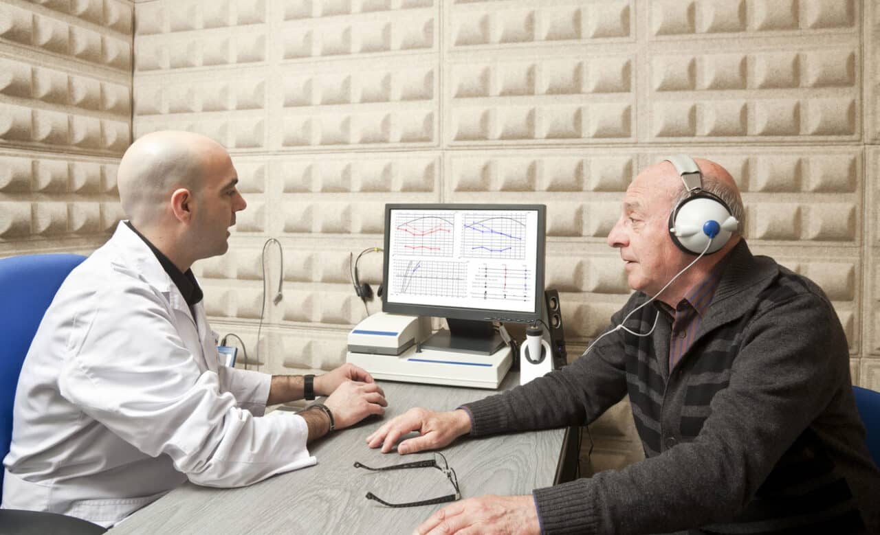 Senior man taking a hearing test